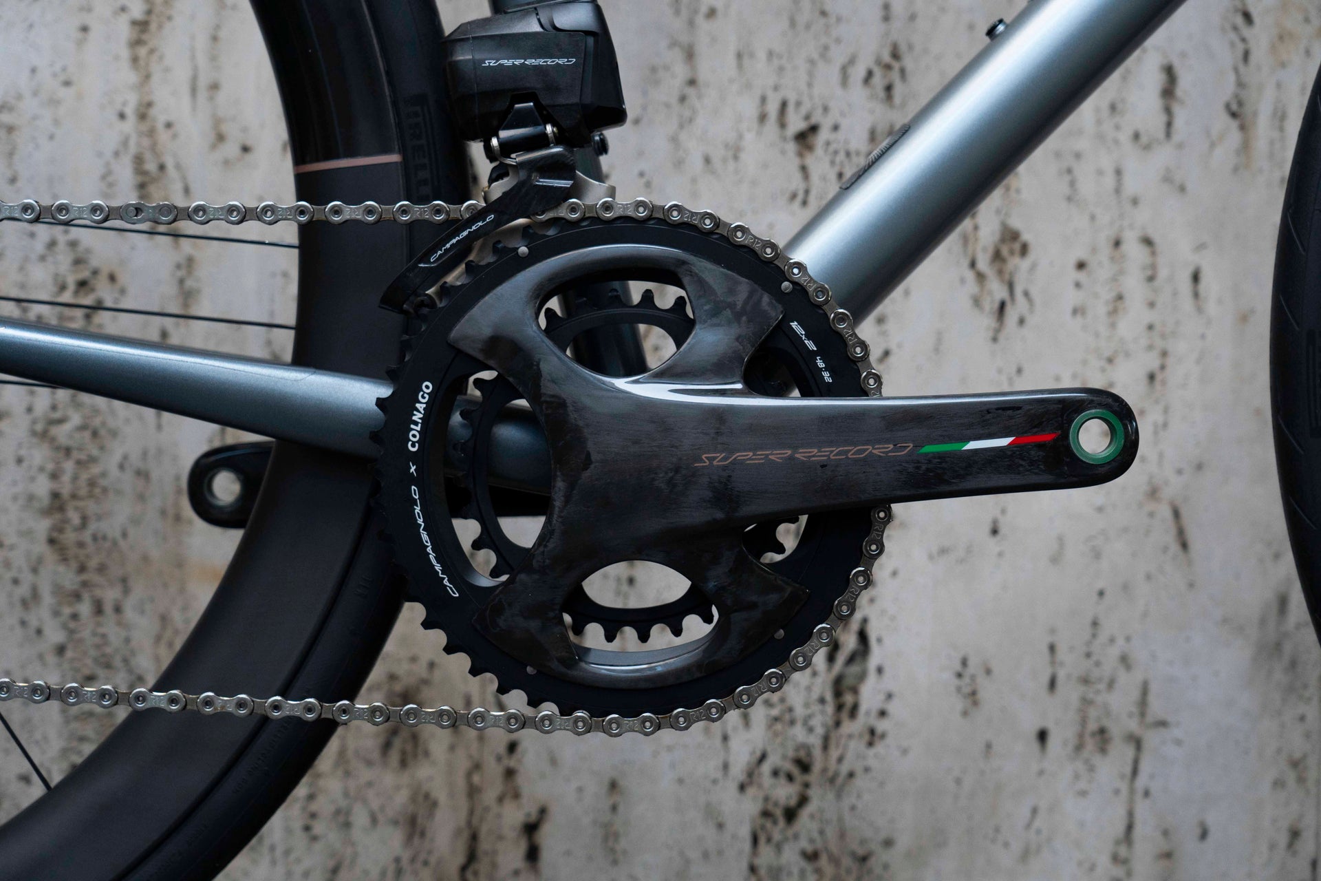 Campagnolo Super Record Wireless carbon road crankset close-up on the luxury Colnago Steelnovo steel complete bicycle by Cicli Corsa.