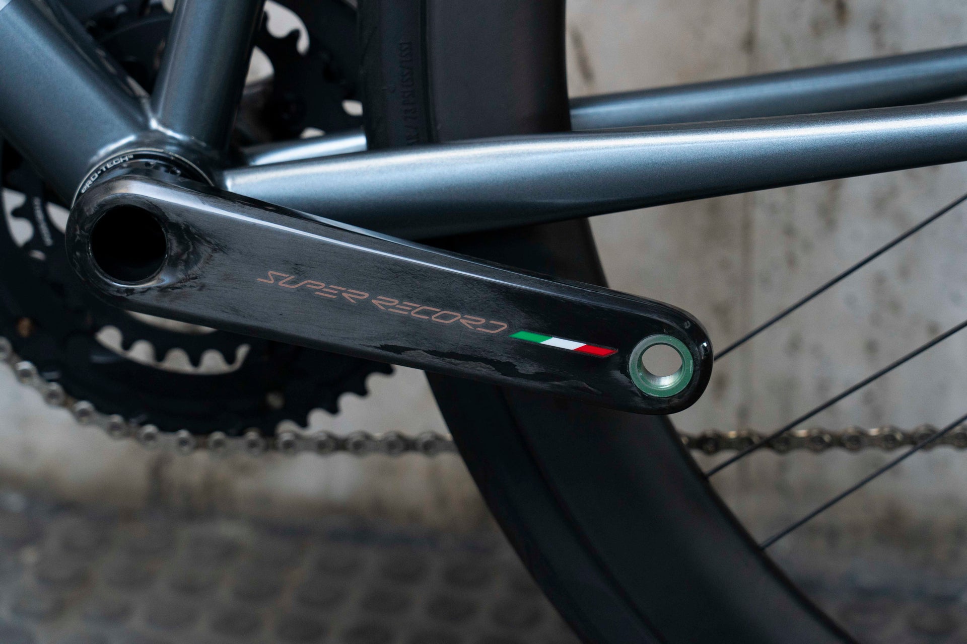 Campagnolo Super Record Wireless carbon road crankset close-up on the luxury Colnago Steelnovo steel complete bicycle by Cicli Corsa.
