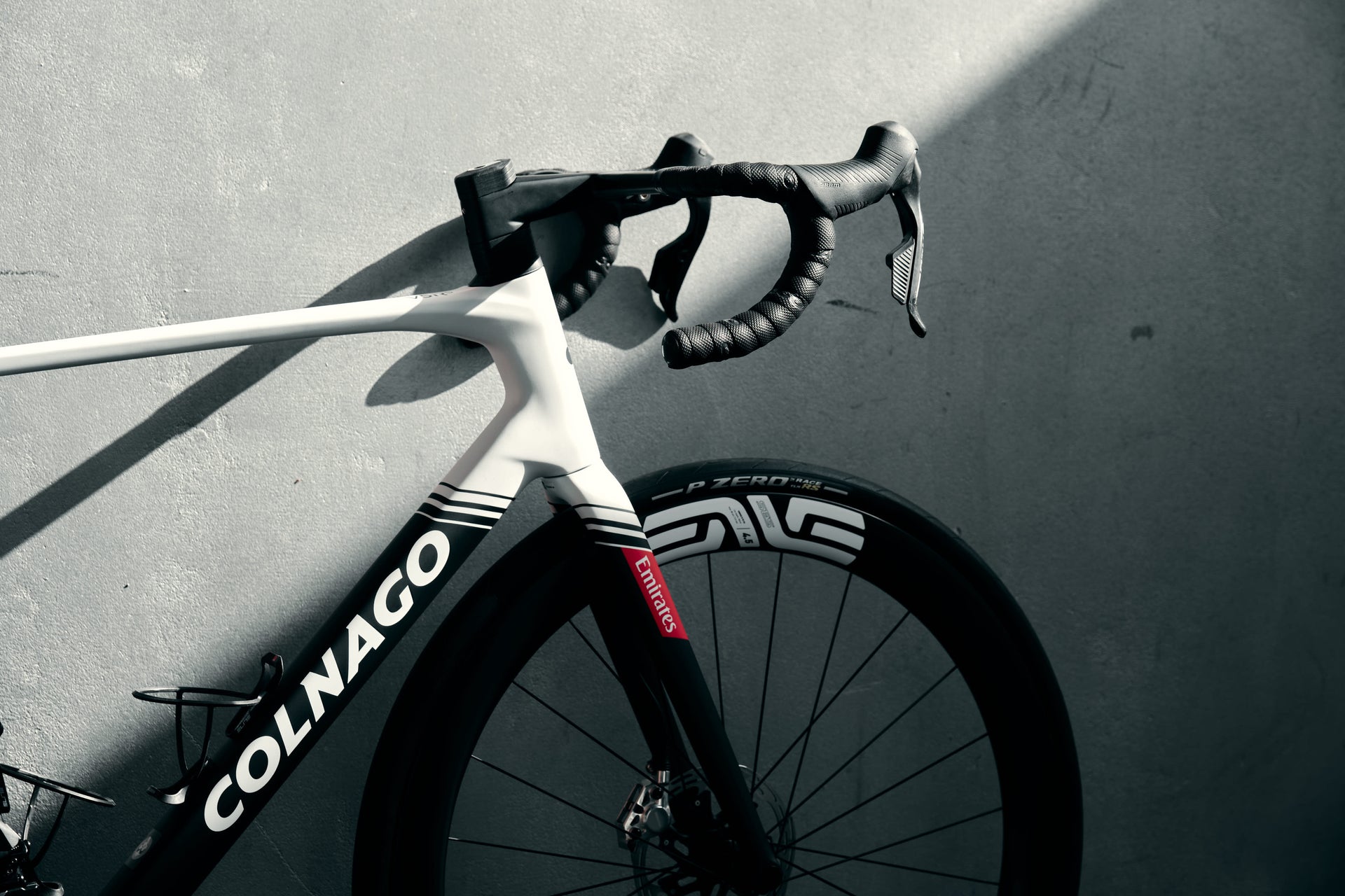 Enve SES 4.5 carbon aerodynamic wheels with custom white decals and premium road tires on the Colnago V5Rs complete bicycle by Cicli Corsa.
