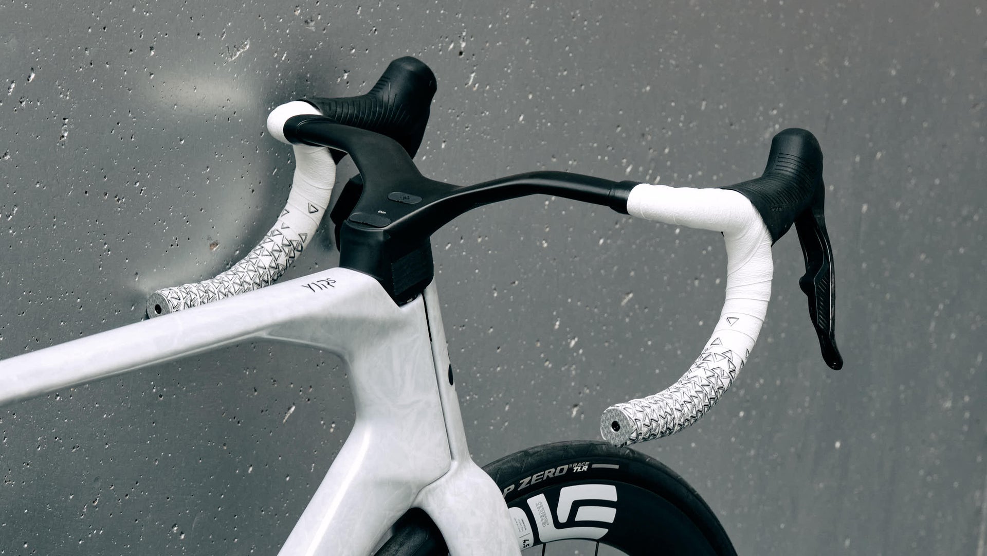 Integrated carbon handlebar with Deda bar tape on the Colnago Y1Rs complete bicycle by Cicli Corsa.