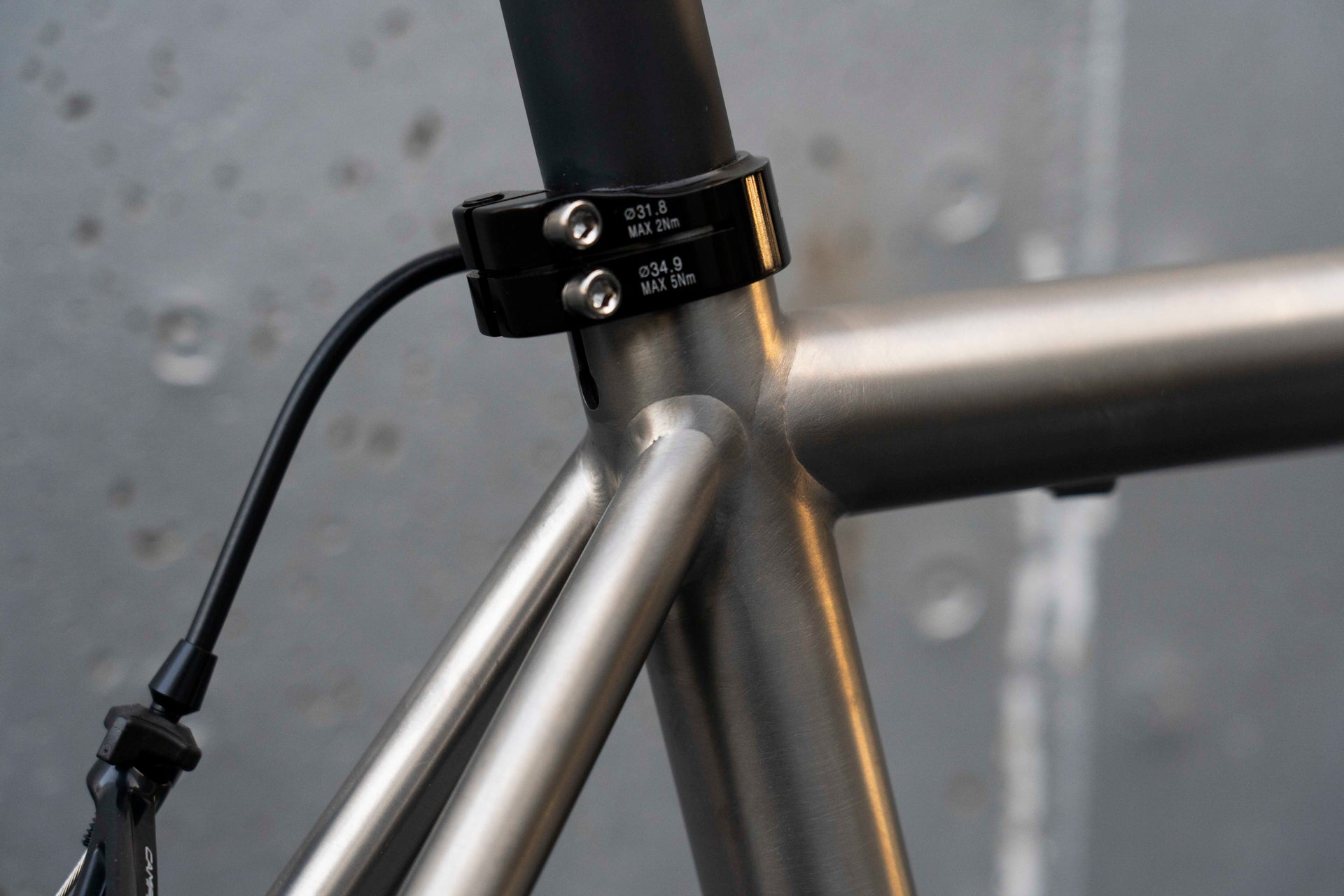 Racing saddle and premium seatpost setup on the hand-welded De Rosa Solo Titanio titanium complete bicycle by Cicli Corsa.