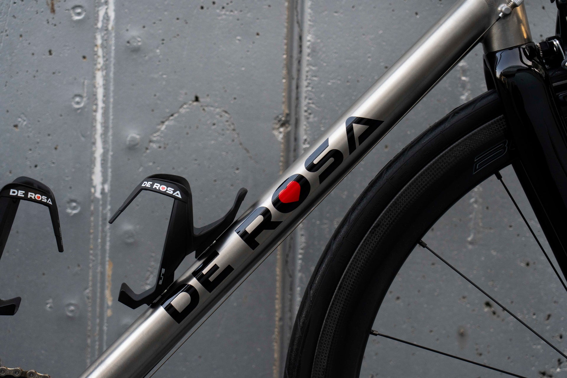 De Rosa branding on the down tube highlighting the exquisite brushed finish of the Solo Titanio complete bicycle by Cicli Corsa.