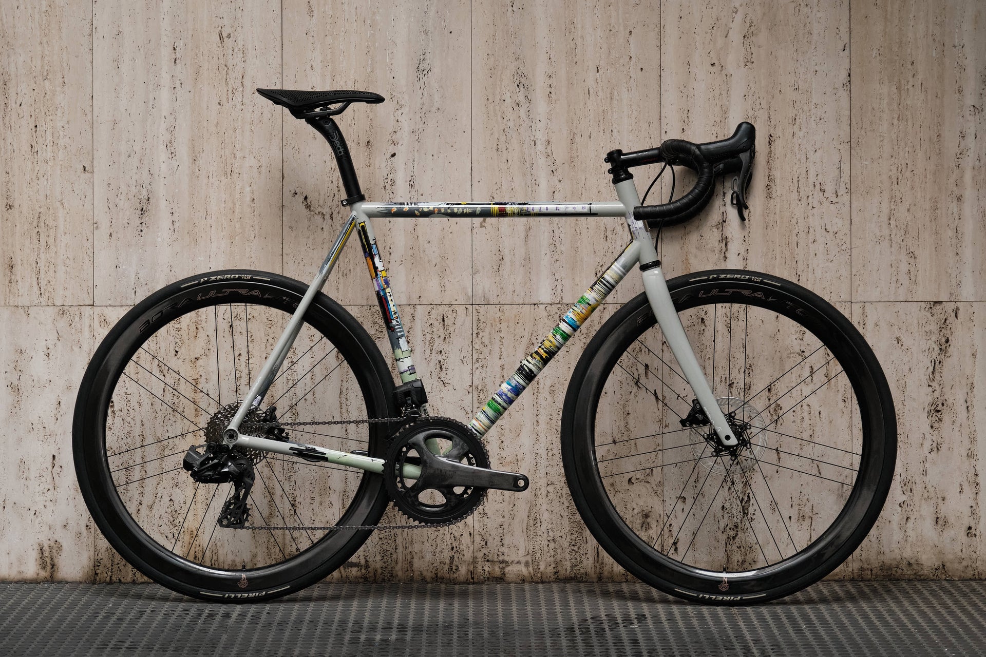 Drive side view of the Dario Pegoretti Responsorium Ciavete stainless steel complete bicycle with Campagnolo Super Record Wireless, custom built by Cicli Corsa.