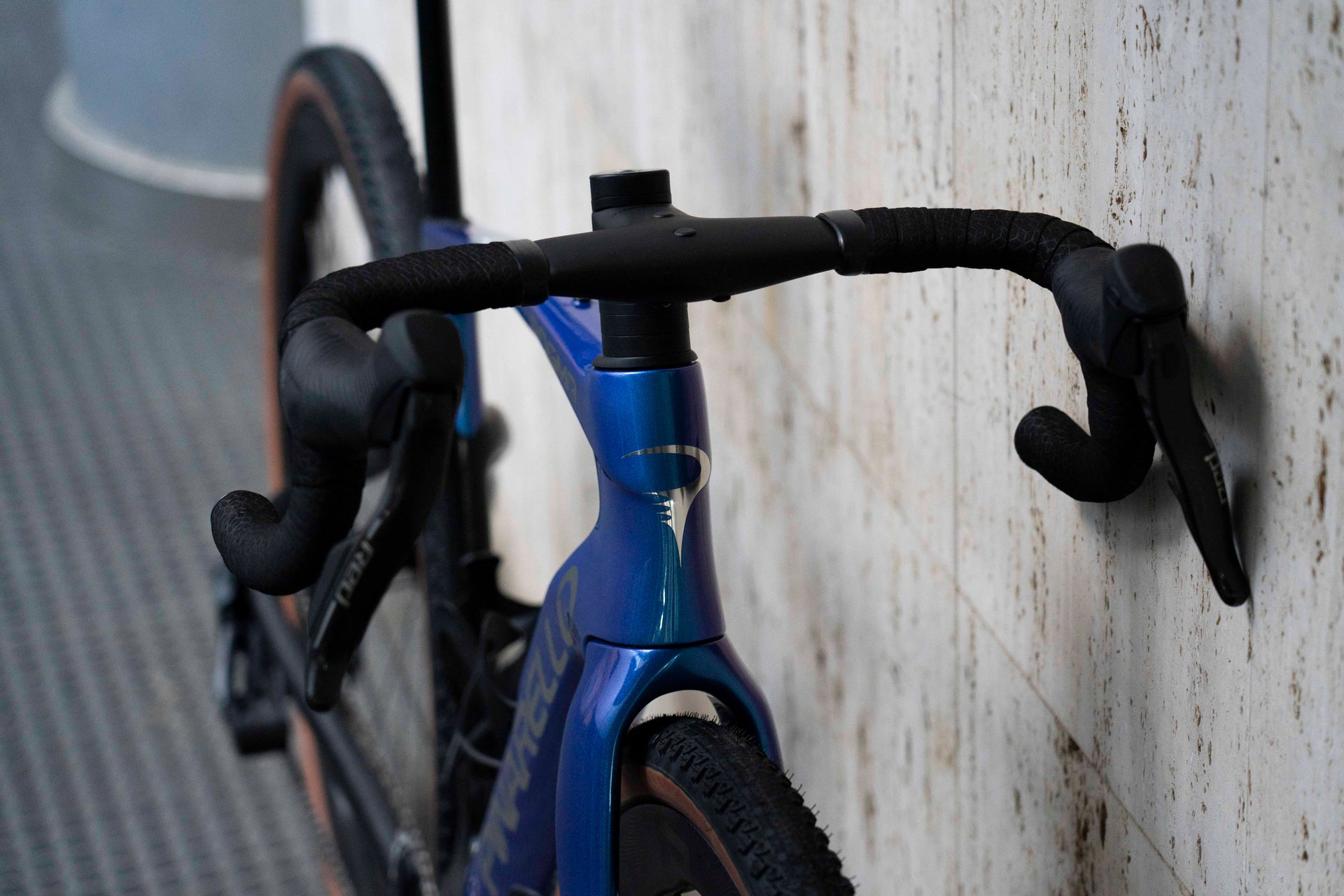 Front-end view of the integrated MOST carbon handlebar and SRAM Red AXS levers on the Pinarello DOGMA GR complete bicycle by Cicli Corsa.