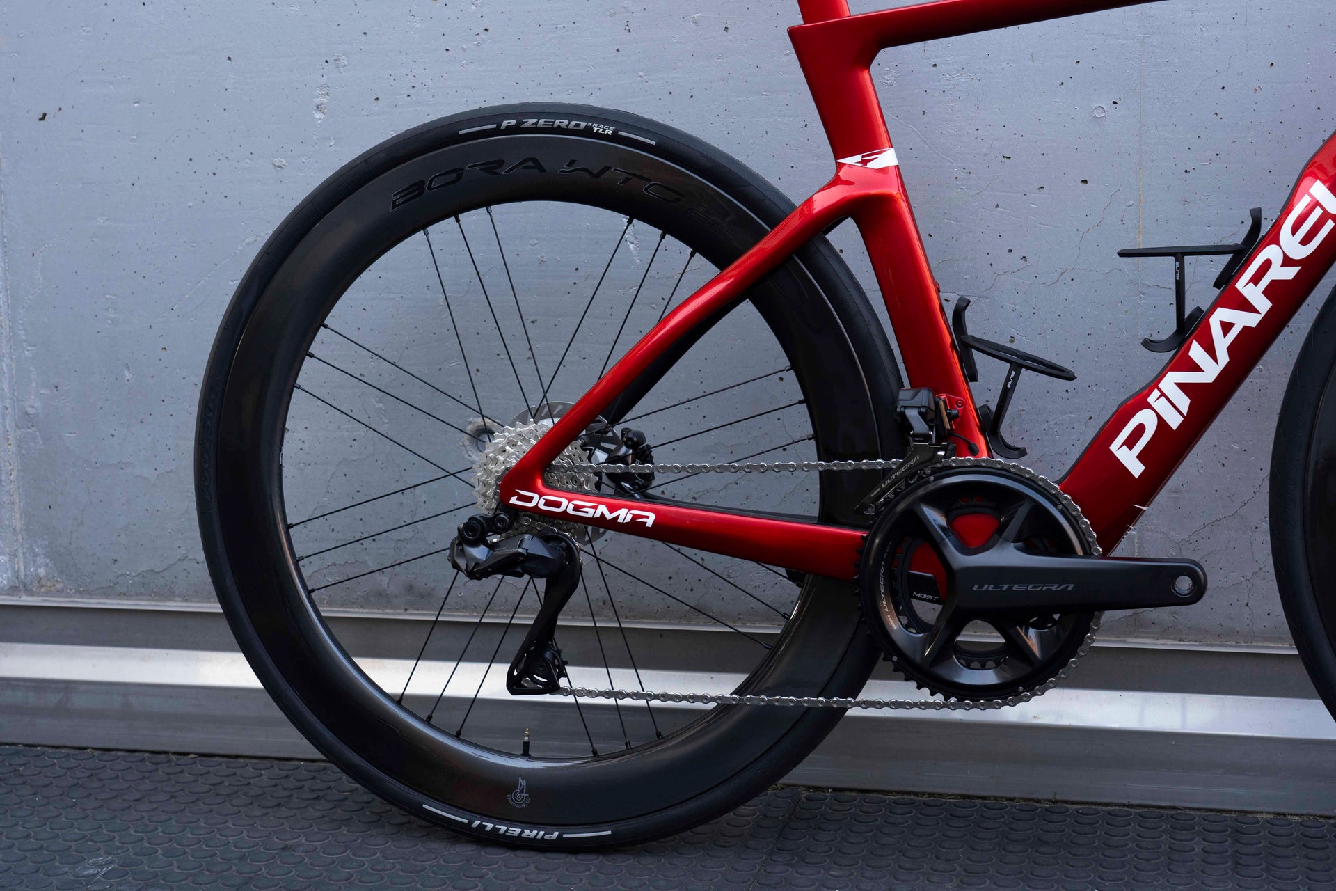 Shimano Ultegra Di2 wireless electronic rear derailleur and 12-speed cassette on the Pinarello Dogma F Starry Red complete bicycle by Cicli Corsa.