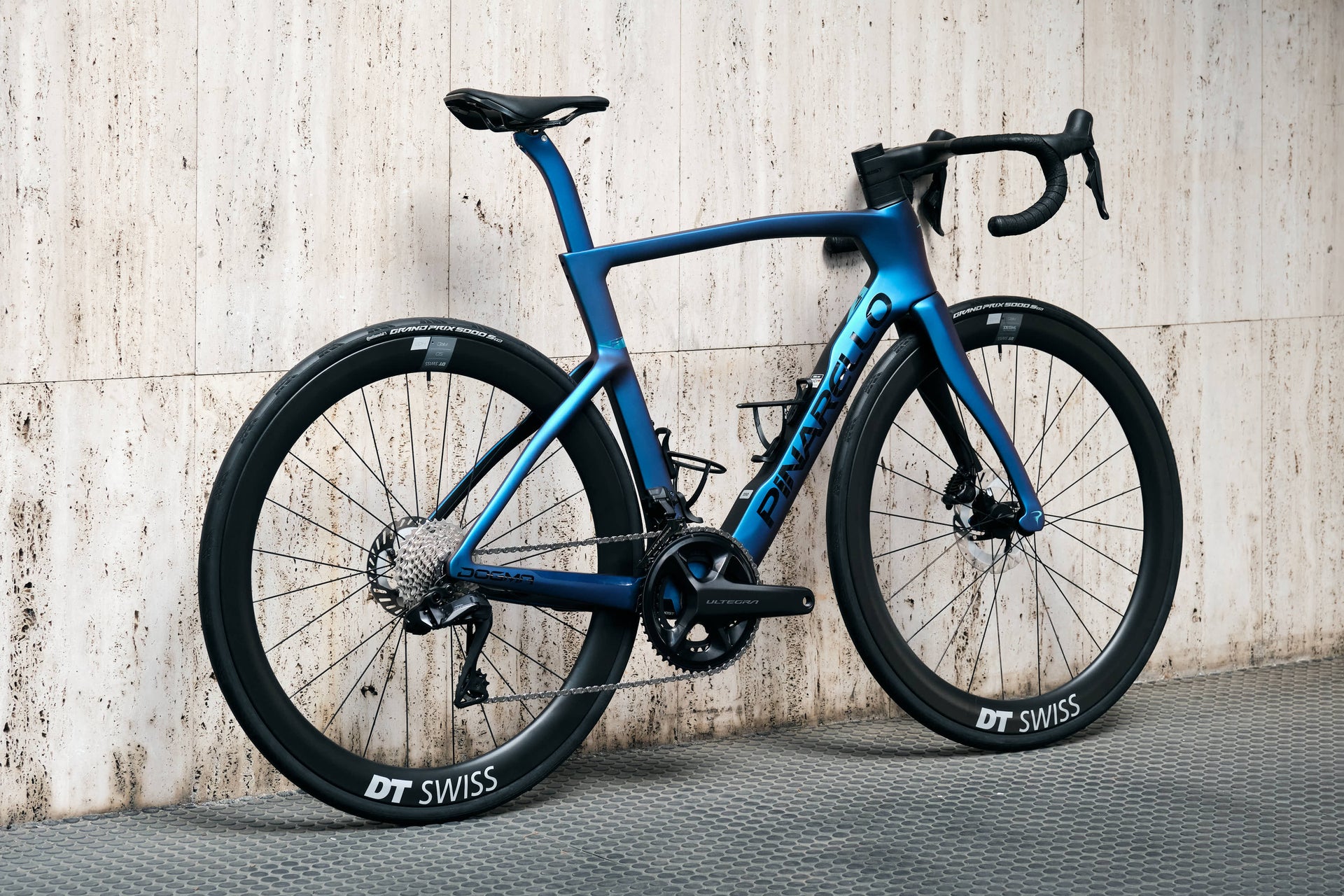 Rear view of the Pinarello Dogma F custom road complete bicycle with Continental Grand Prix 5000 S TR tires, tailor-made by Cicli Corsa.