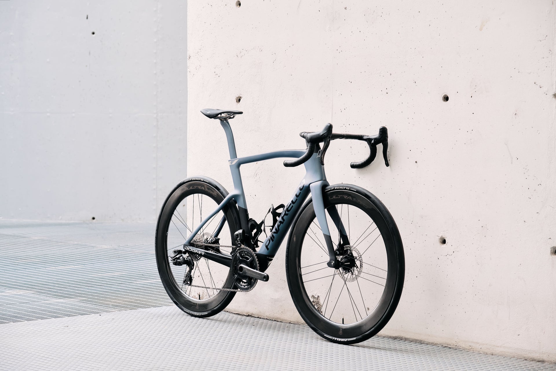 Front view of the Pinarello Dogma F Luxter Grey premium road racing complete bicycle, custom aerodynamic bicycle build by Cicli Corsa.