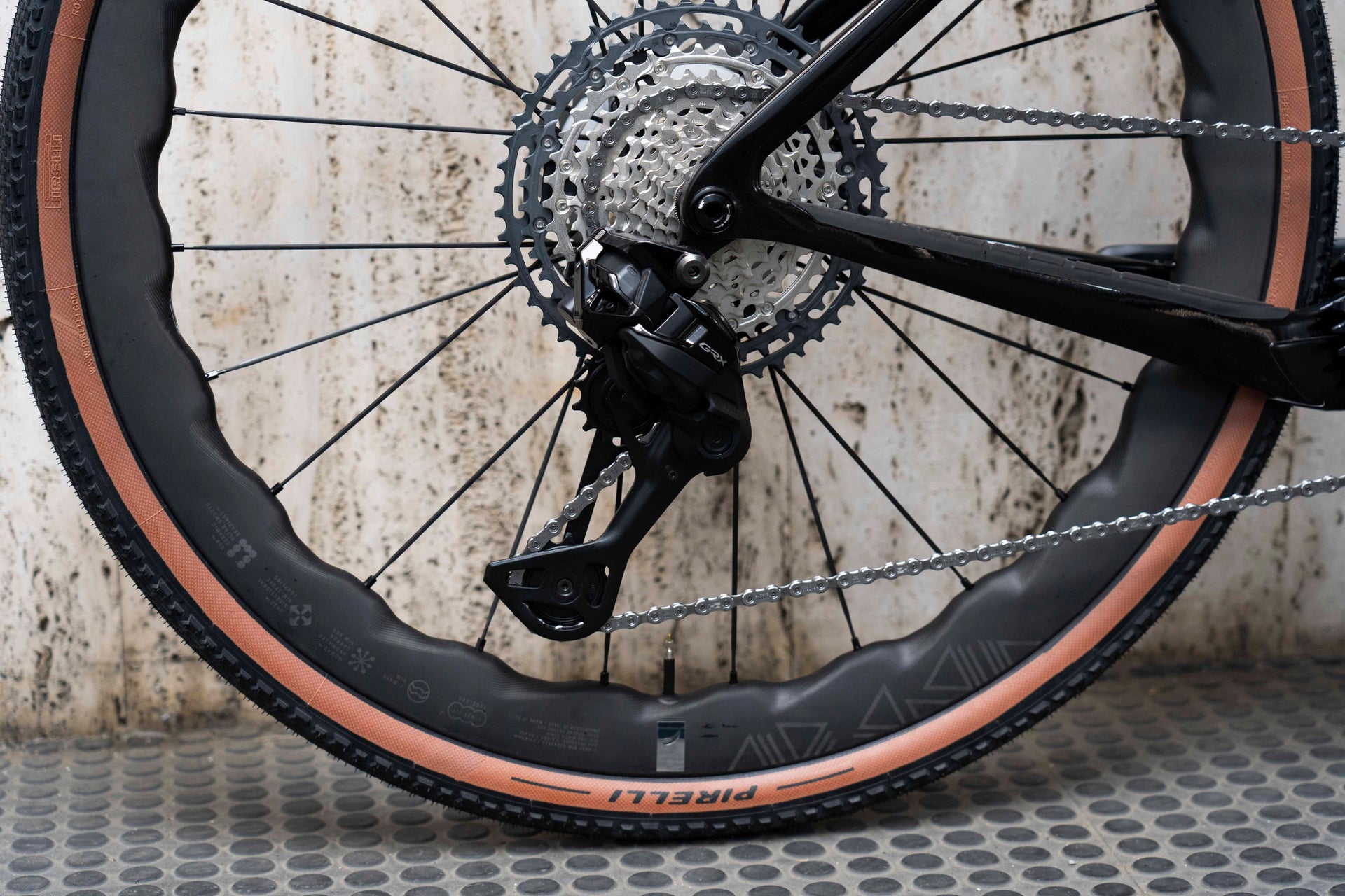 Shimano GRX 12-speed gravel rear derailleur and wide-range cassette on the Pinarello Dogma GR Luxter Blue Shiny complete bicycle by Cicli Corsa.