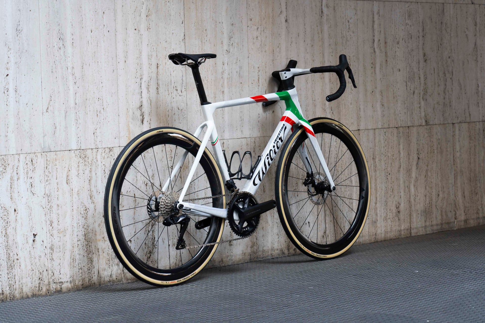 Rear view of the Wilier Filante SLR custom aero road complete bicycle in official Italian Champion graphics, tailor-made by Cicli Corsa.