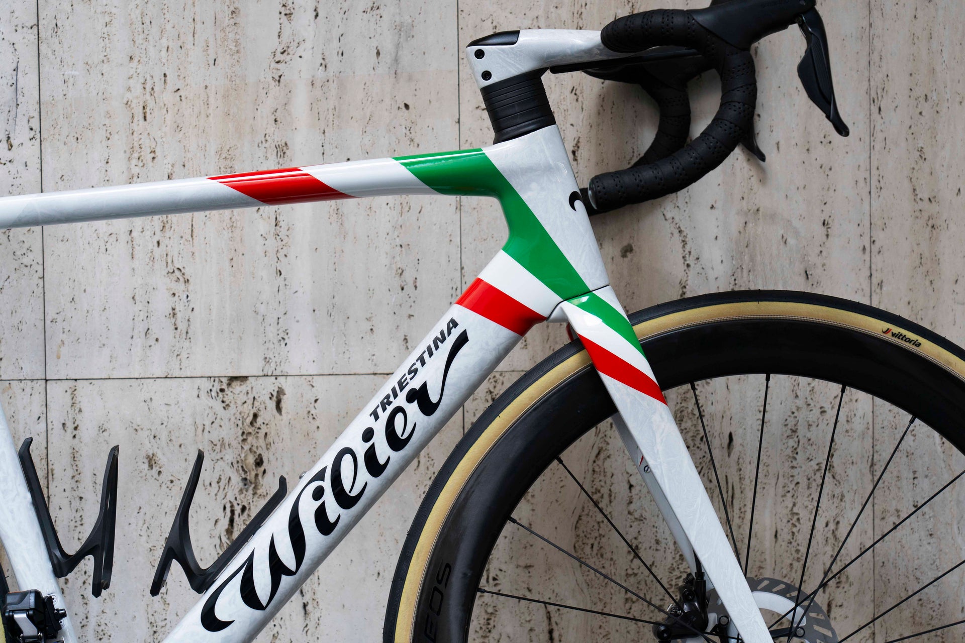 Internal cable routing and integrated aero headset detail on the celebratory Wilier Filante SLR F16 complete bicycle by Cicli Corsa.