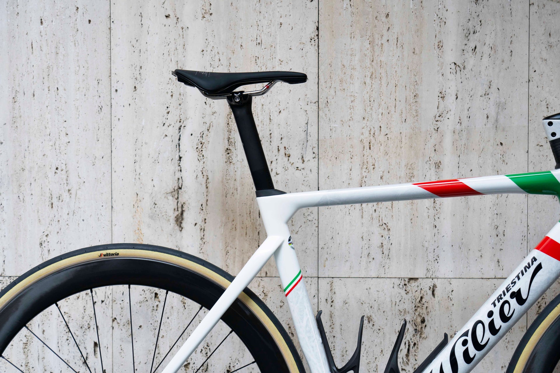 Racing saddle and custom integrated aerodynamic carbon seatpost on the Wilier Filante SLR Campione Italiano complete bicycle by Cicli Corsa.