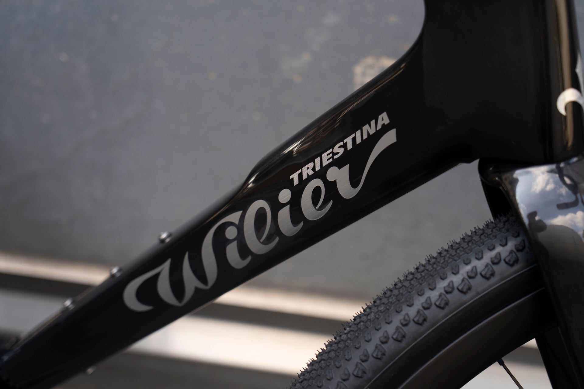 Wilier Triestina branding on the down tube highlighting the premium Glitch Black paint finish on the Rave SLR complete bicycle by Cicli Corsa.