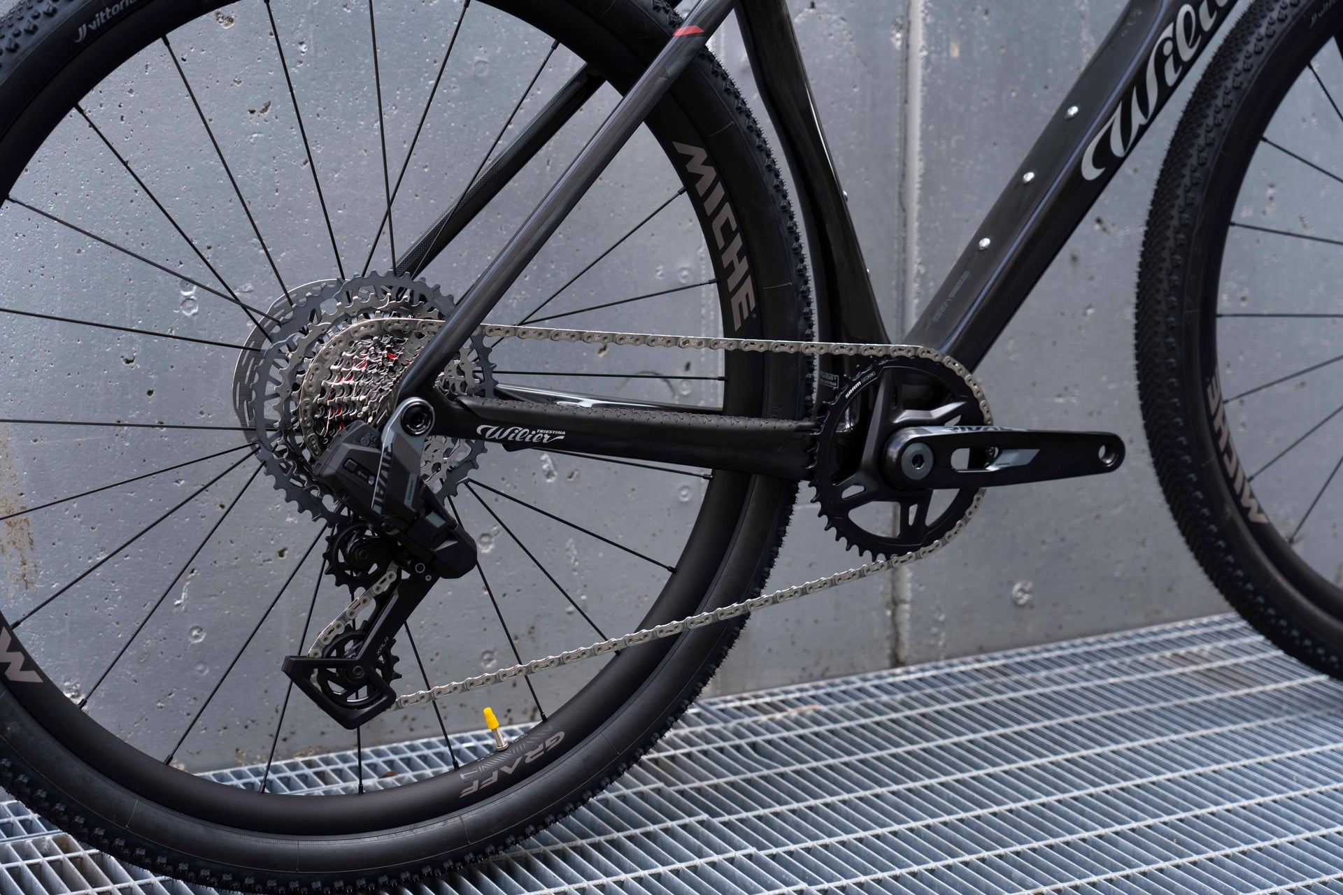 SRAM Rival XPLR 12-speed gravel drivetrain and chainring setup detail on the custom Wilier Rave SLR complete bicycle by Cicli Corsa.