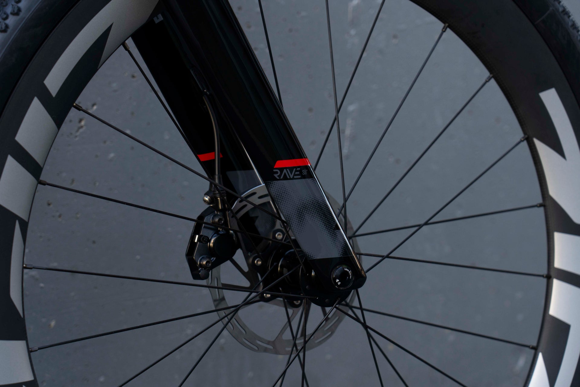 Front SRAM Force disc brake rotor and ZIPP hub on the Wilier Rave SLR complete bicycle by Cicli Corsa.