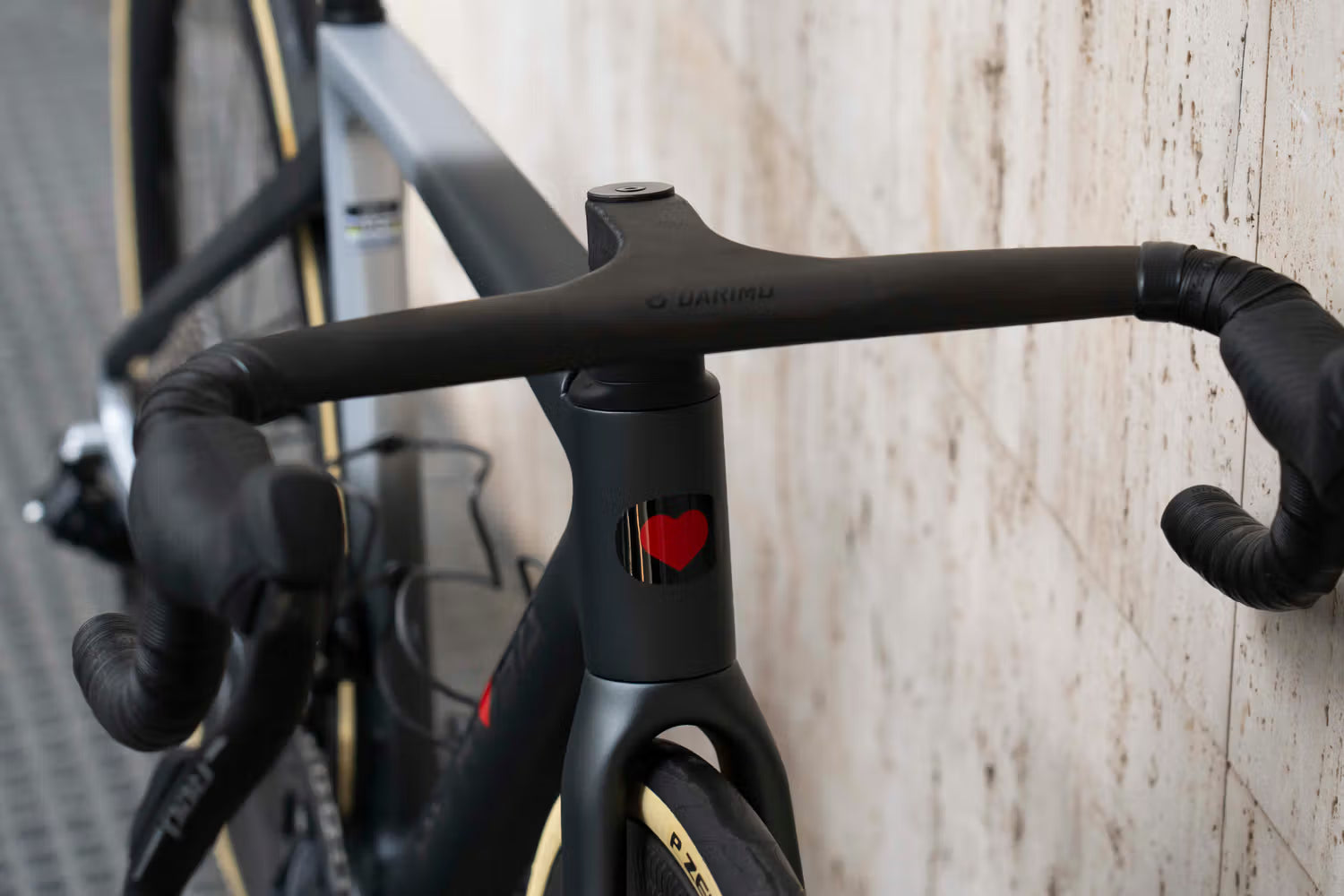 Front-end view of the integrated carbon cockpit and SRAM Red E1 wireless levers on the custom De Rosa 70 Eclipse Gray complete bicycle by Cicli Corsa.