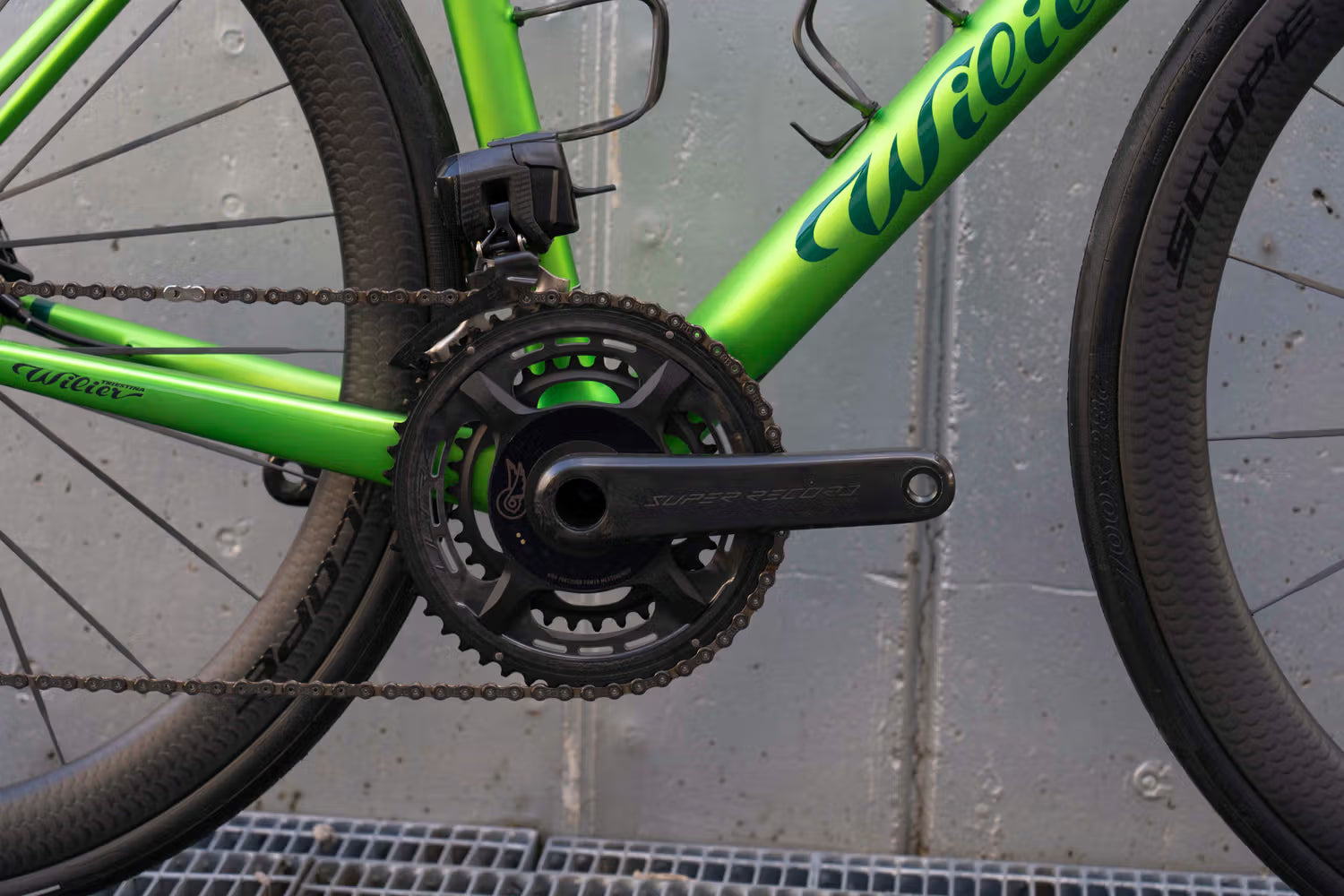 Campagnolo Super Record Wireless carbon crankset with integrated power meter close-up on the Wilier Verticale SLR complete bicycle by Cicli Corsa.