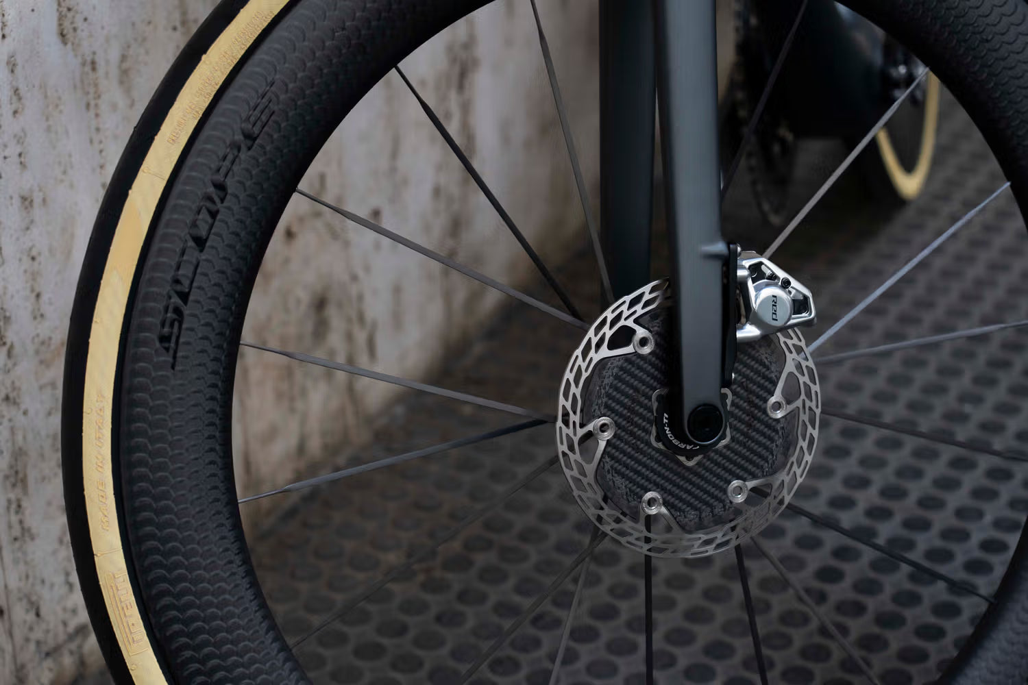 SRAM Red E1 hydraulic disc brake caliper on the aerodynamic carbon fiber fork of the De Rosa 70 complete bicycle by Cicli Corsa.